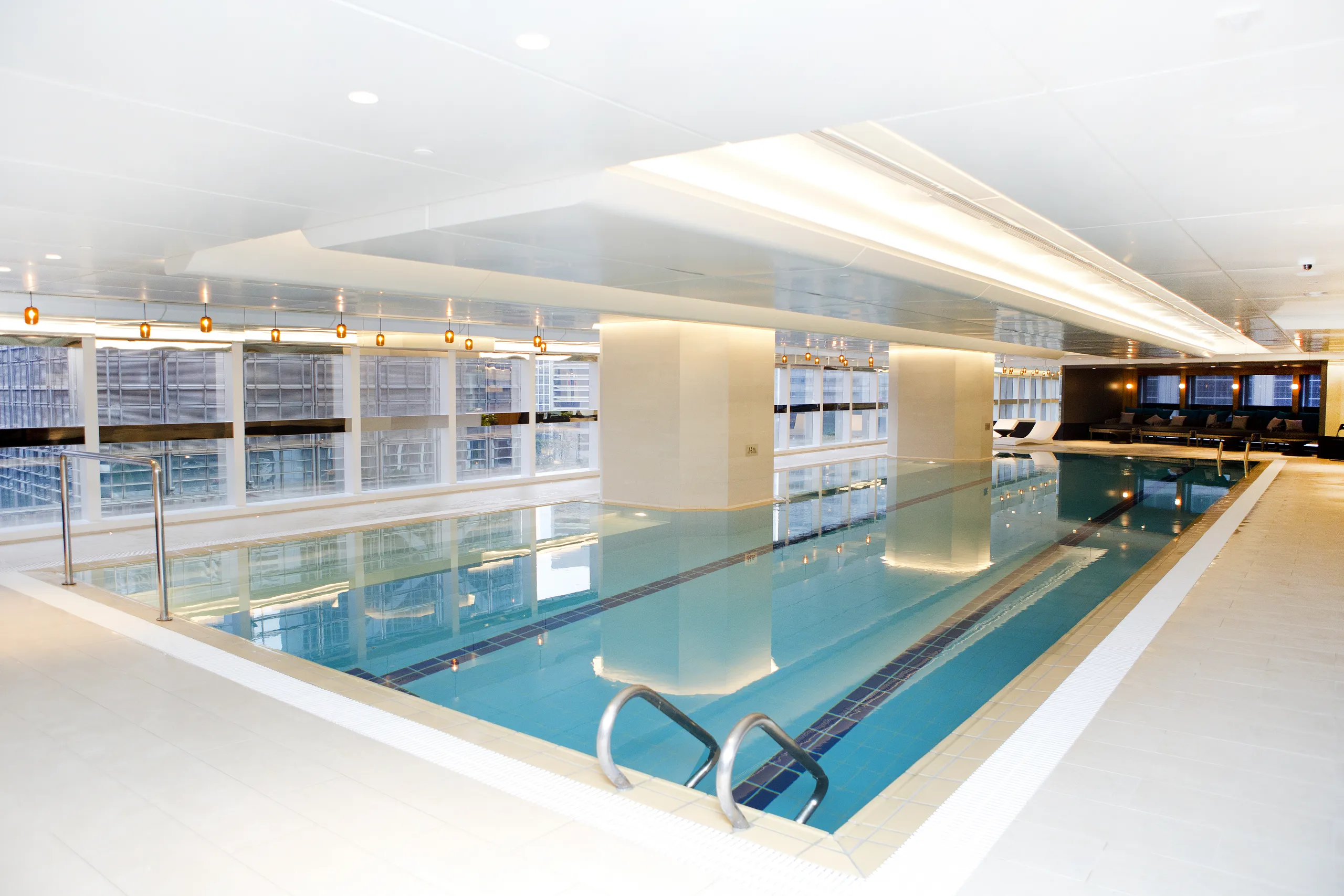 ICBC Tower: Indoor swimming pool beneath a bright sculptural ceiling.